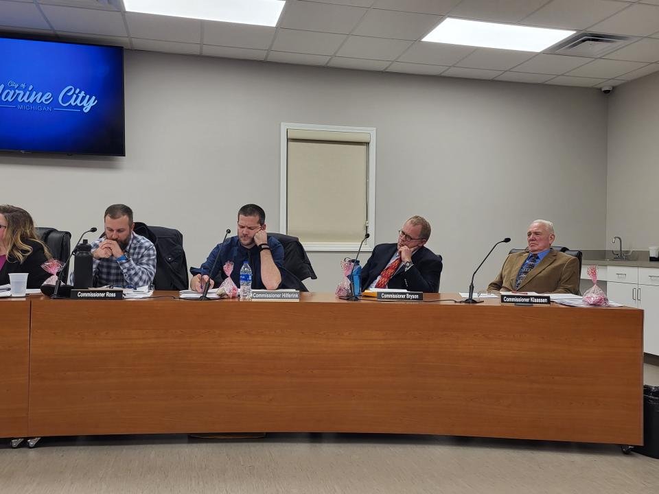 Marine City Commissioners Brian Ross, from left, Mike Hilferink, Jacob Bryson, and Bill Klaassen watch on during public comment at their meeting on Monday, Jan. 16, 2023.