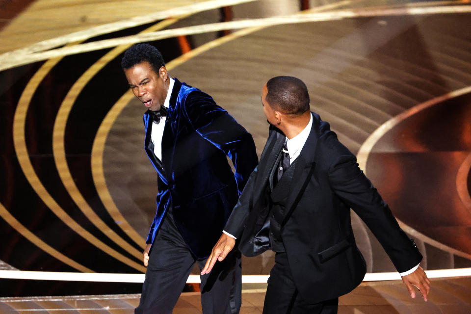 HOLLYWOOD, CA - March 27, 2022. Will Smith slaps Chris Rock onstage during the show at the 94th Academy Awards at the Dolby Theatre at Ovation Hollywood on Sunday, March 27, 2022. (Myung Chun / Los Angeles Times via Getty Images)