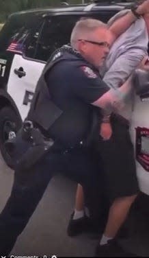 Still taken from video of Graham Police officer Douglas Strader making an arrest at the Pines Apartments April 21.