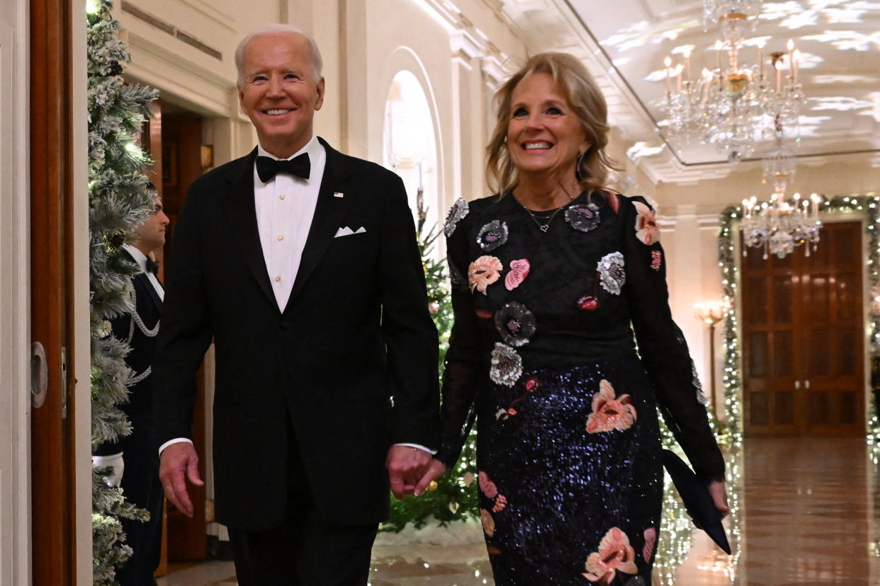 US President Joe Biden and First Lady Jill Biden arrive at a reception for the Kennedy Center Honorees in the East Room of the White House in Washington, DC, on December 4, 2022. (Photo by SAUL LOEB / AFP) (Photo by SAUL LOEB/AFP via Getty Images)
