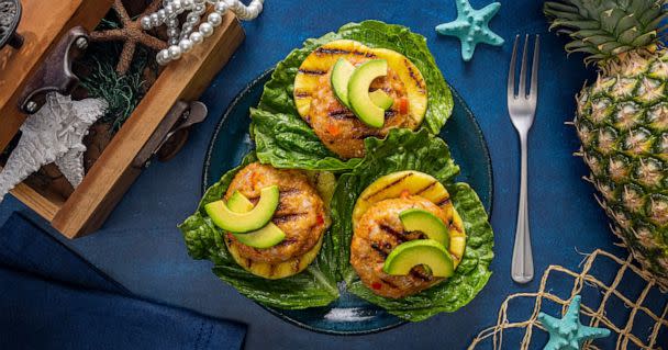 PHOTO: Grilled shrimp and pineapple patties topped with avocado. (The Dole Food Company)