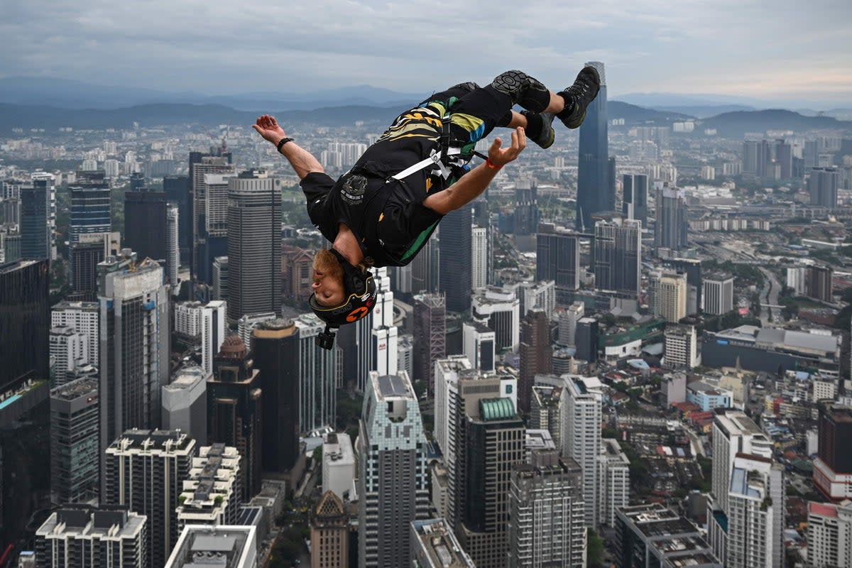 Base jumper Connor Young of Australia leaps from the 300-metre high open deck of Malaysia's landmark Kuala Lumpur Tower during the International Tower Jump in Kuala Lumpur (AFP/Getty)