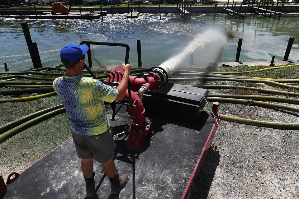 Man blasting water into St. Lucie River