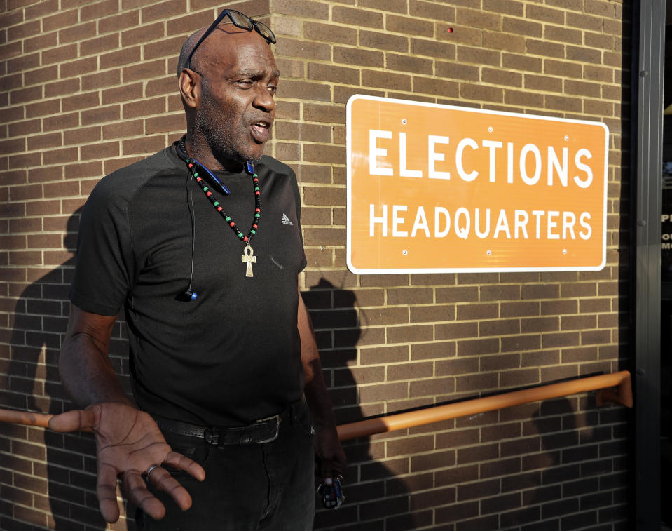 CORRECTS LAST NAME TO ECKFORD NOT ECKERD - Former felon Robert Eckford talks with reporters after registering to vote at the Supervisor of Elections office Tuesday, Jan. 8, 2019, in Orlando, Fla. Former felons in Florida began registering for elections on Tuesday, when an amendment that restores their voting rights went into effect. (AP Photo/John Raoux)