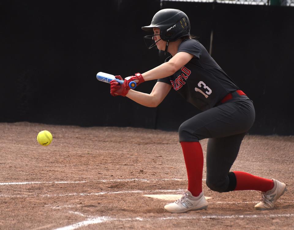 Bedford's Payton Pudlowski lays down a bunt during a game last season. Pudlowski has done more swinging away than bunting this spring. She has set school records for RBI and triples.