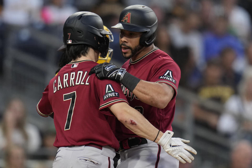 Arizona Diamondbacks' Tommy Pham, right, celebrates with teammate Corbin Carroll after hitting a two-run home run during the fourth inning of a baseball game against the San Diego Padres, Thursday, Aug. 17, 2023, in San Diego. (AP Photo/Gregory Bull)