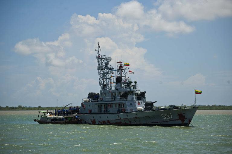 A Myanmar navy ship is anchored near Haigyi island, NgaPuTaw Township, Irrawaddy Division on May 30, 2015