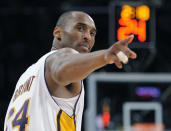 FILE - In this June 7, 2009 file photo Los Angeles Lakers guard Kobe Bryant (24) points to a player behind him after making a basket in the closing seconds against the Orlando Magic in Game 2 of the NBA basketball finals in Los Angeles. Bryant, the 18-time NBA All-Star who won five championships and became one of the greatest basketball players of his generation during a 20-year career with the Los Angeles Lakers, died in a helicopter crash Sunday, Jan. 26, 2020. He was 41. (AP Photo/Mark J. Terrill, file)