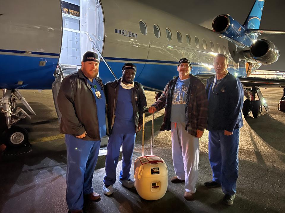 From left to right: Surgical assistant Bryan Andrews, surgical assistant Dr. Bright Ohene, lead transplant surgeon Dr. Joe Rubelowsky, and organ preservationist Paul Lignoski in Juneau, Alaska on April 27, 2023.