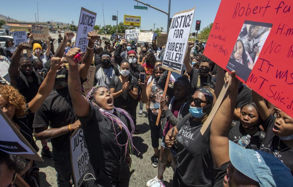 Hundreds of demonstrators gather at the Los Angeles County Sheriff's Department's Palmdale Station