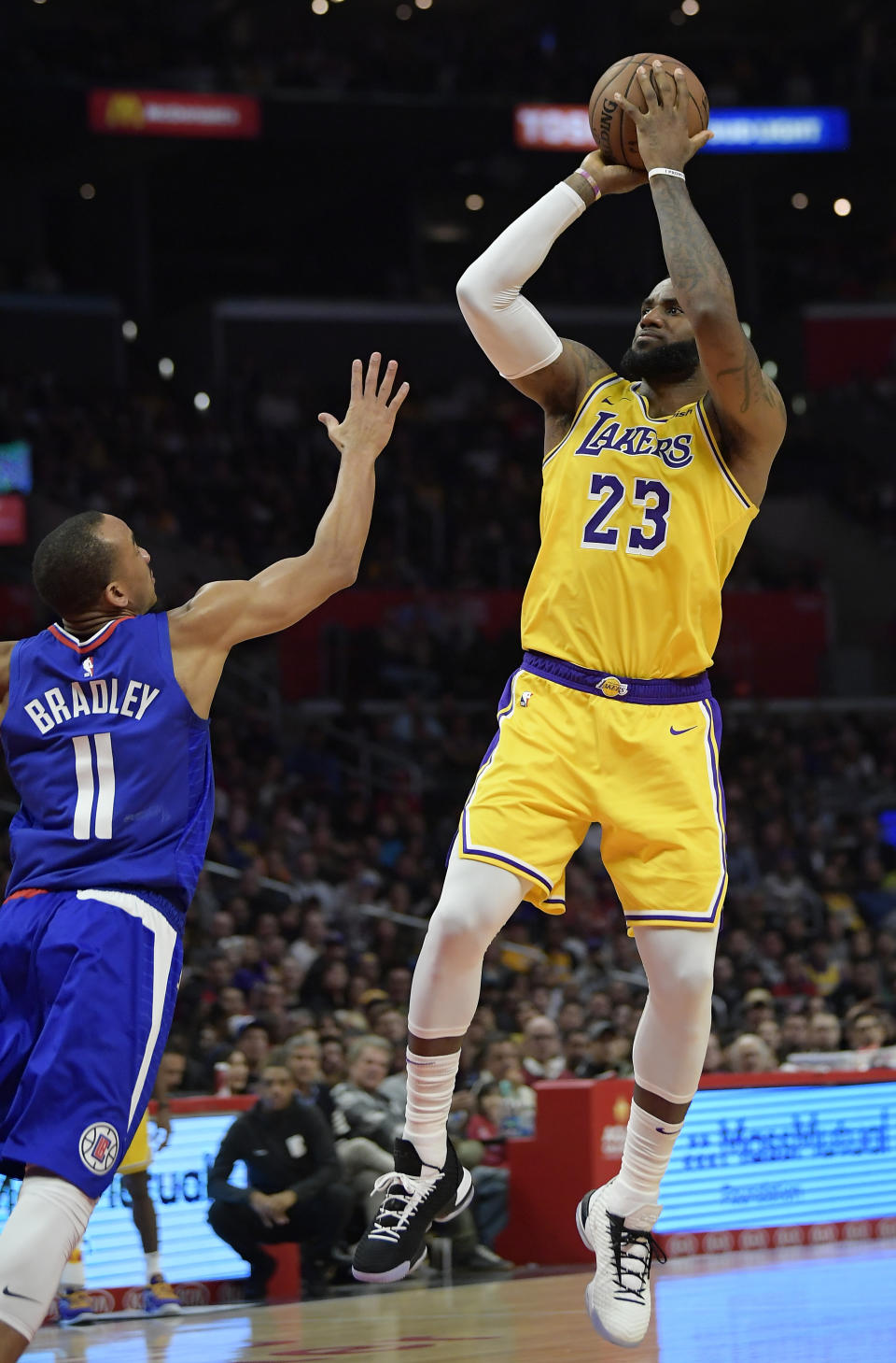 Los Angeles Lakers forward LeBron James, right, shoots as Los Angeles Clippers guard Avery Bradley defends during the second half of an NBA basketball game Thursday, Jan. 31, 2019, in Los Angeles. The Lakers won 123-120. (AP Photo/Mark J. Terrill)