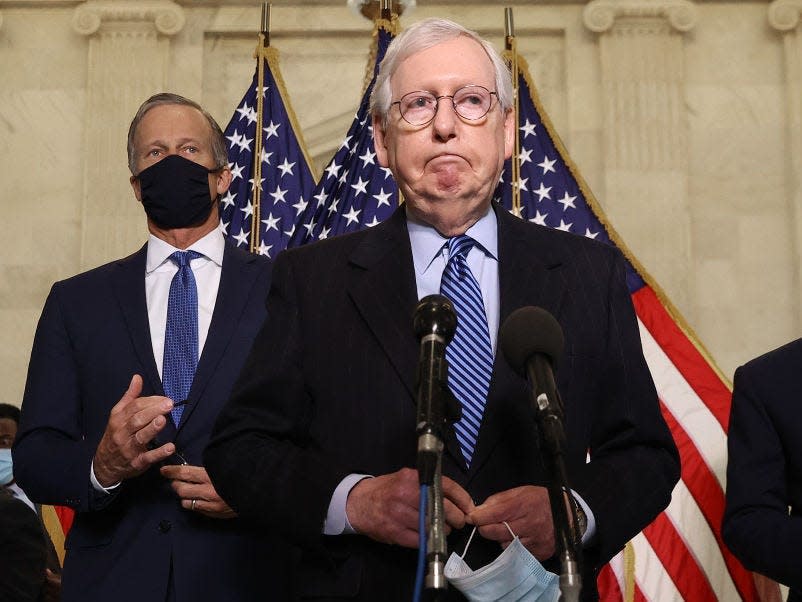 Senate Minority Leader Mitch McConnell (R-KY) talks to reporters with Sen. John Thune (R-SD) (L) and Sen. Roy Blunt (R-MO) following the weekly Senate Republican caucus luncheon in the Russell Senate Office Building on Capitol Hill March 16, 2021 in Washington, DC.