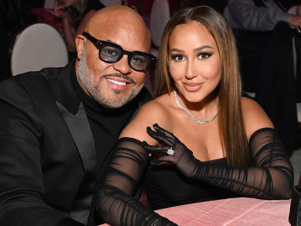 <p>Michael Kovac/Getty</p> Israel Houghton and Adrienne Bailon