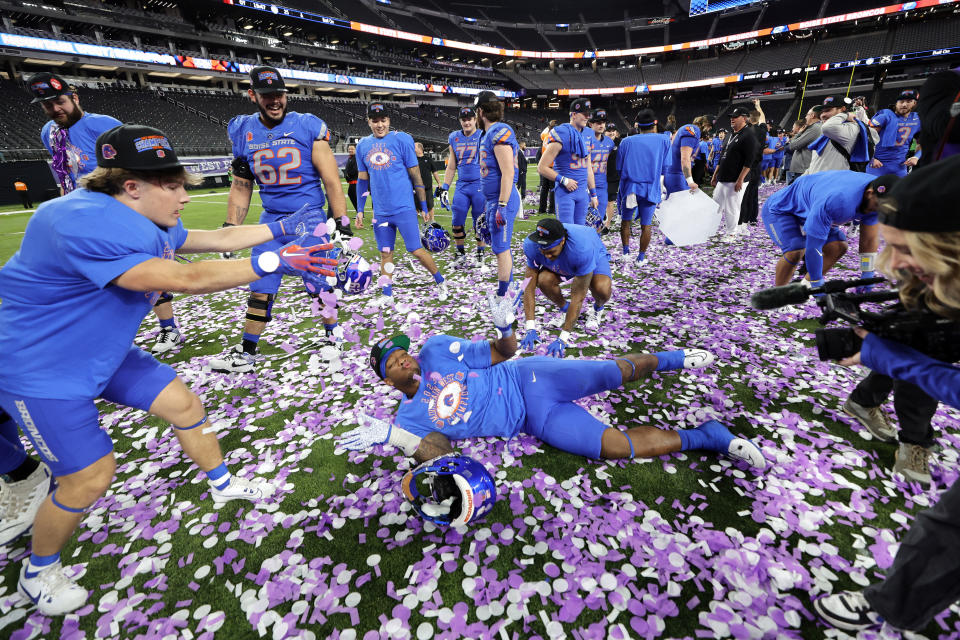 Boise State defensive end Cortez Hogans, center, plays in confetti after of the Mountain West championship NCAA college football game against UNLV, Saturday, Dec. 2, 2023, in Las Vegas. (Steve Marcus/Las Vegas Sun via AP)