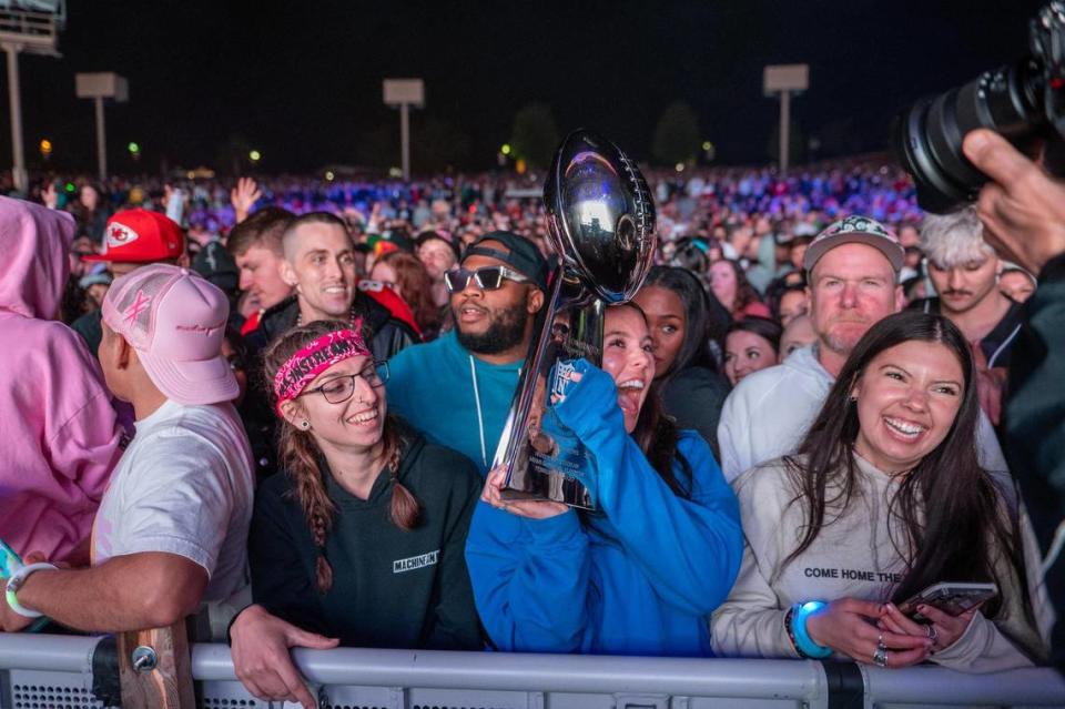 Fans hold up a dented Vince Lombardi Trophy replica during Kelce Jam at the Azura Amphitheater on Friday, April 28, 2023, in Bonner Springs.