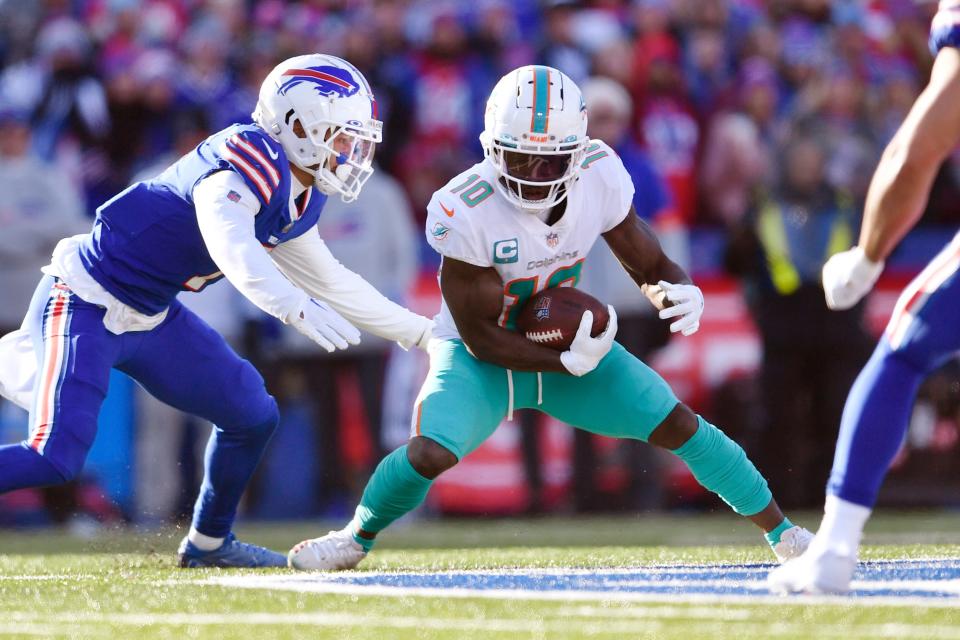 Miami Dolphins wide receiver Tyreek Hill (10) carries the ball during the first half of an NFL wild-card playoff game against the Buffalo Bills on Jan. 15 in Orchard Park, N.Y.