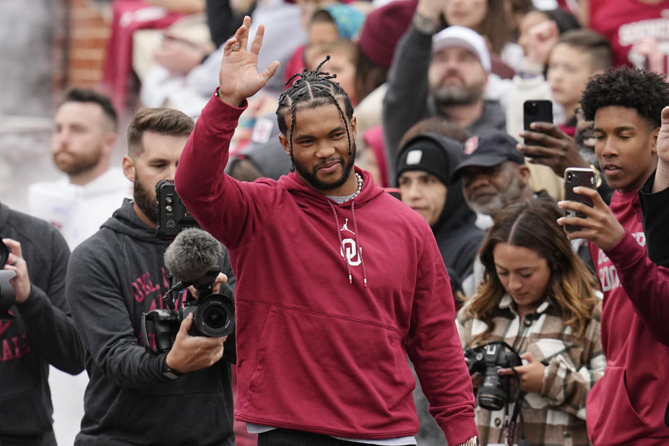 Former Oklahoma quarterback and 2018 Heisman Trophy winner Kyler Murray waves as he is introduced during halftime of the NCAA college football team's spring game Saturday, April 22, 2023, in Norman, Okla. (AP Photo/Sue Ogrocki)