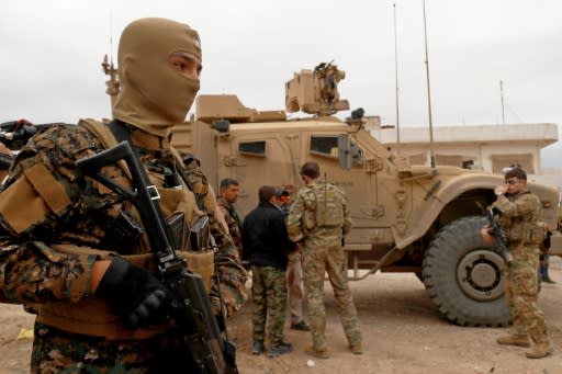 US forces patrol the Kurdish-held Syrian town of Al-Darbasiyah on the Turkish border on November 4, 2018, part of a deployment intended to deter a Turkish attack that the Kurds fear may go ahead after Washington's announcement last month of a pullout