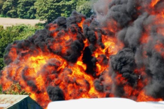 A huge fireball erupted after the jet crashed into the dual carriageway (EPA) (Paul Jarrett/EPA)
