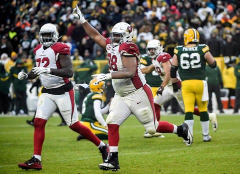 Arizona Cardinals defensive tackle Corey Peters (98) celebrates after the Cardinals defeated the Green Bay Packers at Lambeau Field - Credit: Benny Sieu/USA TODAY