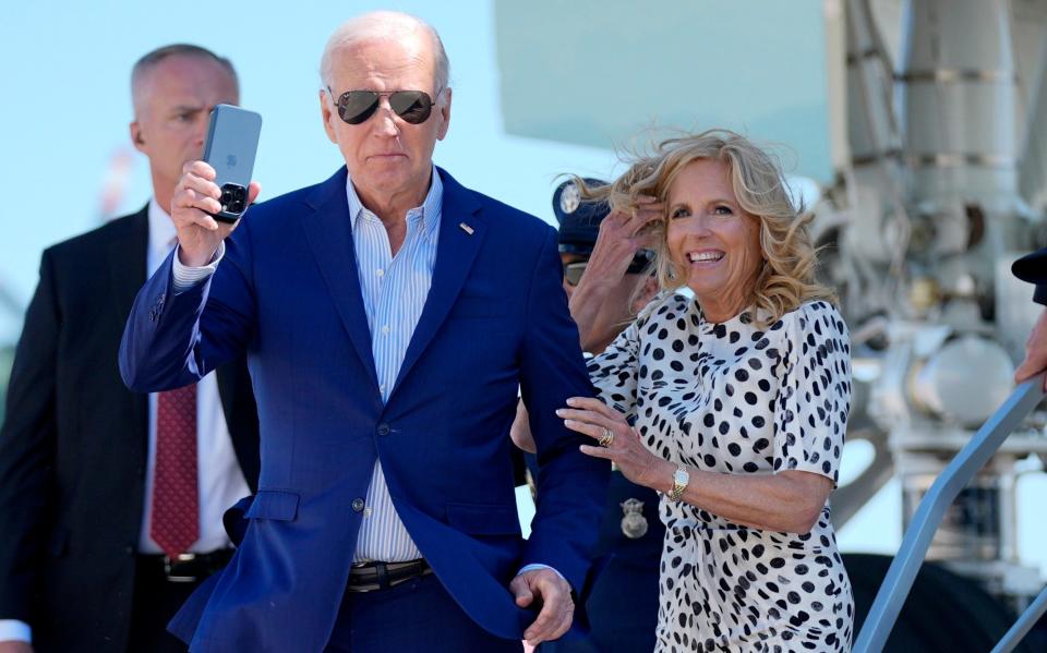 Joe Biden and first lady Jill Biden arrive at John F. Kennedy International Airport in New York on Friday, the day after the TV debate