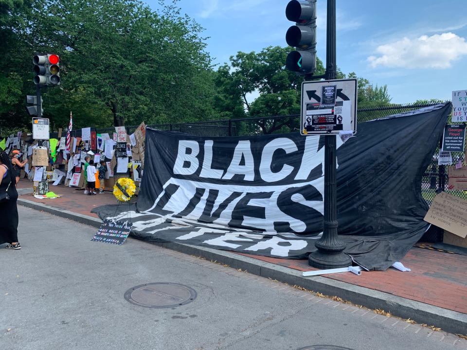 A sprawling black flag attached to the fence at the north side of Lafayette Square in Washington, D.C. on June 9, 2020. (Brittany Shepherd)
