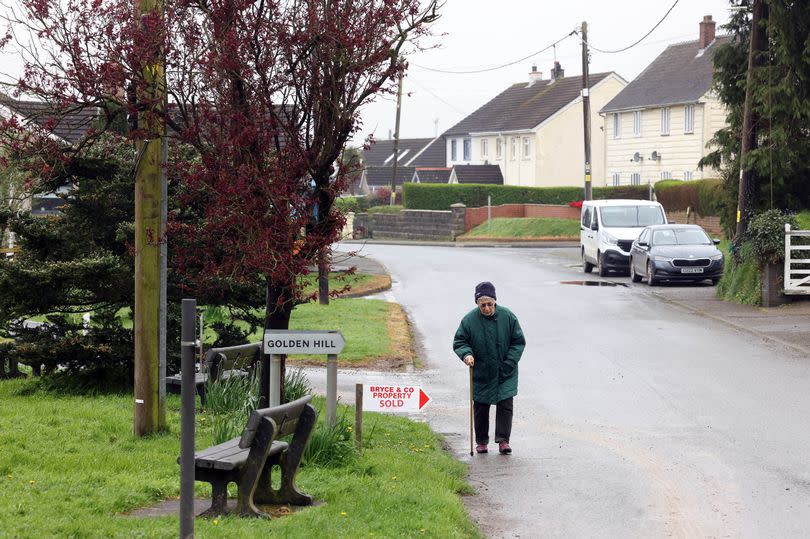 Woman walking down road