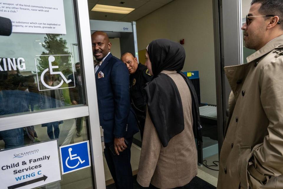 Assemblyman Mike A. Gipson, left, enters the Warren E. Thornton Youth Center with a group that included other state legislators on May 3, 2023, to tour the former juvenile detention facility where Sacramento County officials have housed foster youth for the past six months. Representatives from the media were not allowed inside the facility.