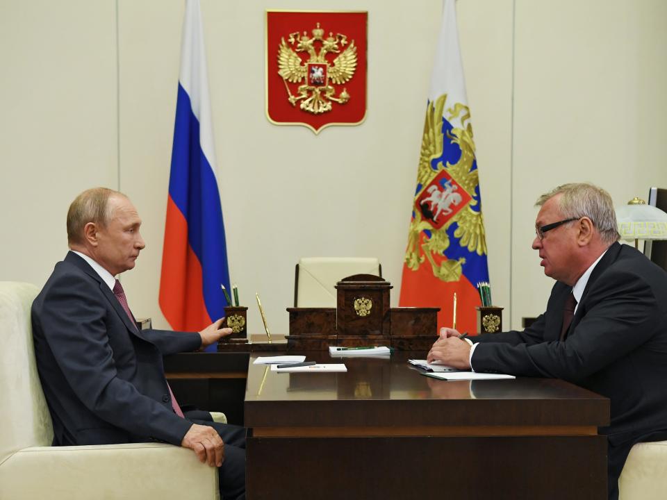 Russia's President Vladimir Putin (L) and VTB Bank president Andrei Kostin talk during a 2020 meeting in the Novo-Ogaryovo residence.