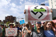 <p>Thousands of protesters march in Boston against a planned ‘Free Speech Rally’ just one week after the violent ‘Unite the Right’ rally in Virginia left one woman dead and dozens more injured on Aug. 19, 2017 in Boston, Mass. (Photo: Spencer Platt/Getty Images) </p>