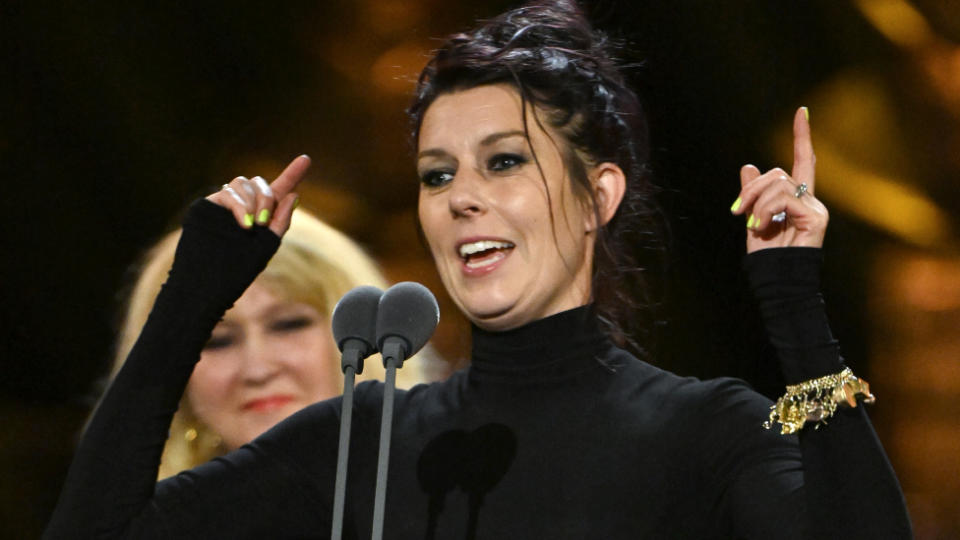 Kate Trefry with the Noël Coward Award for Best New Entertainment or Comedy Play on stage during The Olivier Awards 2024 at The Royal Albert Hall on April 14, 2024 in London, England