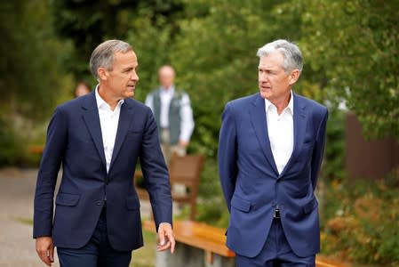 Federal Reserve Chair Jerome Powell and Governor of the Bank of England, Mark Carney, are seen during the three-day "Challenges for Monetary Policy" conference in Jackson Hole, Wyoming