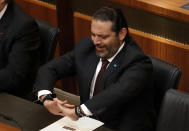 Lebanese Prime Minister Saad Hariri, gestures during the opening session on the draft 2019 state budget, at the parliament building, in Beirut, Lebanon, Tuesday, July 16, 2019. The lawmakers have begun discussing the draft 2019 state budget amid tight security and limited protests against proposed austerity measures. The proposed budget aims to avert a financial crisis by raising taxes and cutting public spending in an effort to reduce a ballooning deficit. (AP Photo/Hussein Malla)