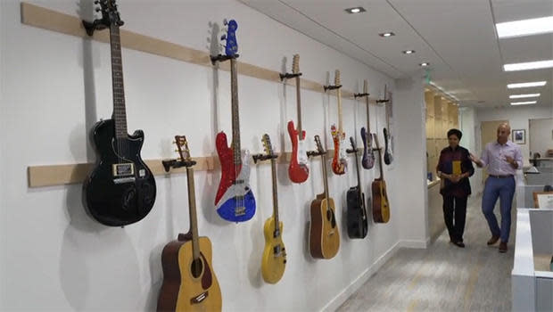 Former PepsiCo CEO Indra Nooyi with her guitar collection.  / Credit: CBS News