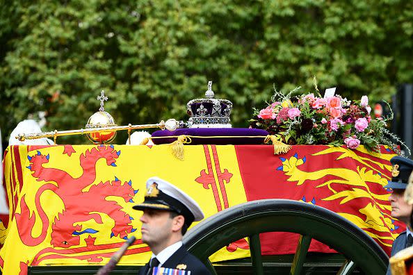 LONDON, ENGLAND - SEPTEMBER 19:The coffin carrying Queen Elizabeth II with the Imperial State Crown and a floral tribute rests on top as it departs Westminster Abbey during the State Funeral of Queen Elizabeth II on September 19, 2022 in London, England. Elizabeth Alexandra Mary Windsor was born in Bruton Street, Mayfair, London on 21 April 1926. She married Prince Philip in 1947 and ascended the throne of the United Kingdom and Commonwealth on 6 February 1952 after the death of her Father, King George VI. Queen Elizabeth II died at Balmoral Castle in Scotland on September 8, 2022, and is succeeded by her eldest son, King Charles III.  (Photo by Jeff Spicer/Getty Images)