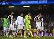<p>Gianluigi Buffon of Juventus is dejected after the UEFA Champions League Final between Juventus and Real Madrid at National Stadium of Wales on June 3, 2017 in Cardiff, Wales. </p>