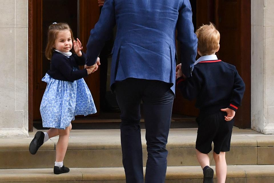 <p>Charlotte perfected a 'turn back to camera' on her way to meet her younger brother Louis at hospital. (AFP)</p> 