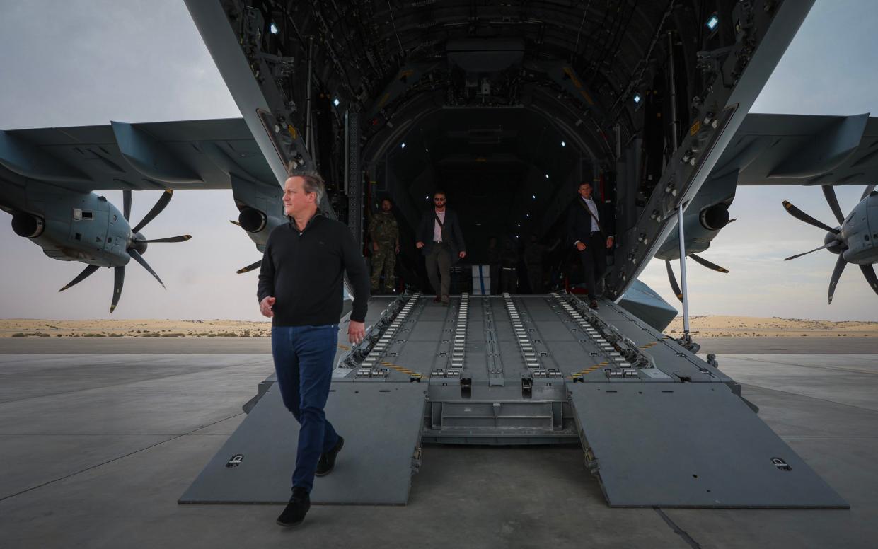 David Cameron arrives from Cairo to an aid distribution centre in Al Arish