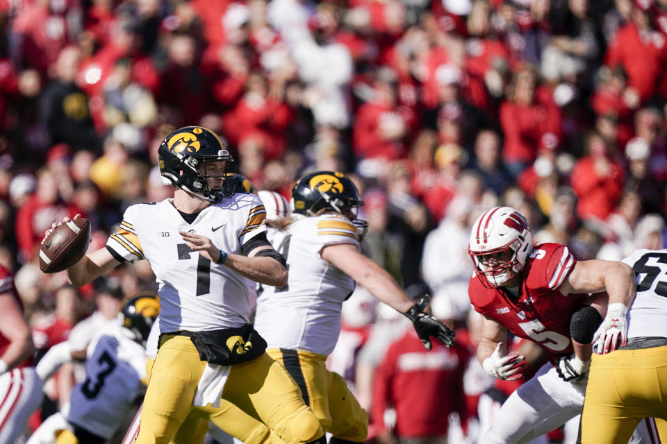 Iowa quarterback Spencer Petras (7) looks to pass against Wisconsin during the second half of an NCAA college football game Saturday, Oct. 30, 2021, in Madison, Wis. Wisconsin upset Iowa 27-7. (AP Photo/Andy Manis)