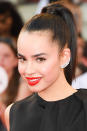 <p>The key to working a bold lip? Keeping the rest of your makeup look simple, as shown by up-and-coming singer Sofa Carson, who paired her bright red lipstick with minimal eye makeup and a slicked back high ponytail. <i>(Photo by George Pimentel/WireImage)</i><br></p>