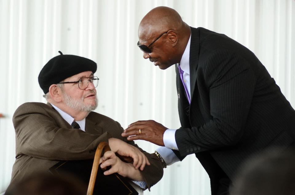 International Boxing Hall of Fame inductee Michael Katz, left, is greeted by Marvin Hagler during the induction ceremony in Canastota, N.Y., Sunday, June 10, 2012. (AP photos/Heather Ainsworth)