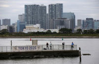 Visitors stroll at Odaiba Marine Park, the venue for Marathon Swimming and Triathlon events during the Tokyo 2020 Games, in Tokyo, Japan October 4, 2017. REUTERS/Issei Kato