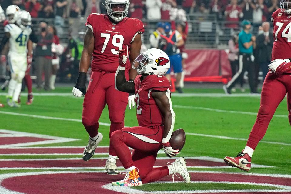 Arizona Cardinals running back Chase Edmonds (2) celebrates his touchdown against the Indianapolis Colts during the first half on Dec. 25, 2021, in Glendale, Arizona. Edmonds is now a Dolphin.