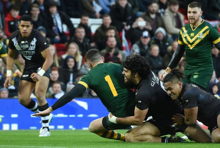 Australia's full-back Darius Boyd (C) scores his team's fifth try during the Rugby League Four Nations Final match against New Zealand in Liverpool November 20, 2016