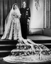 <p>Elizabeth and Philip <a href="https://www.goodhousekeeping.com/beauty/fashion/g4919/queen-elizabeth-wedding-gown/" rel="nofollow noopener" target="_blank" data-ylk="slk:wed in Westminster Abbey;elm:context_link;itc:0;sec:content-canvas" class="link ">wed in Westminster Abbey</a> in front of 2,500 guests, with 200 million more people listening to the ceremony on the radio. </p>