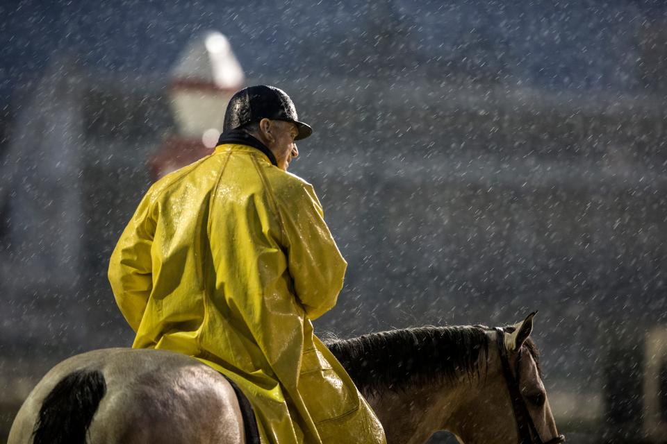 Hall of Fame trainer D. Wayne Lukas watched as his horses train in the pouring rain, at Churchill Downs. Lukas’ Bravazo is scheduled to run in this year’s Kentucky Derby. Lukas has won the race four times. April 23, 2018.