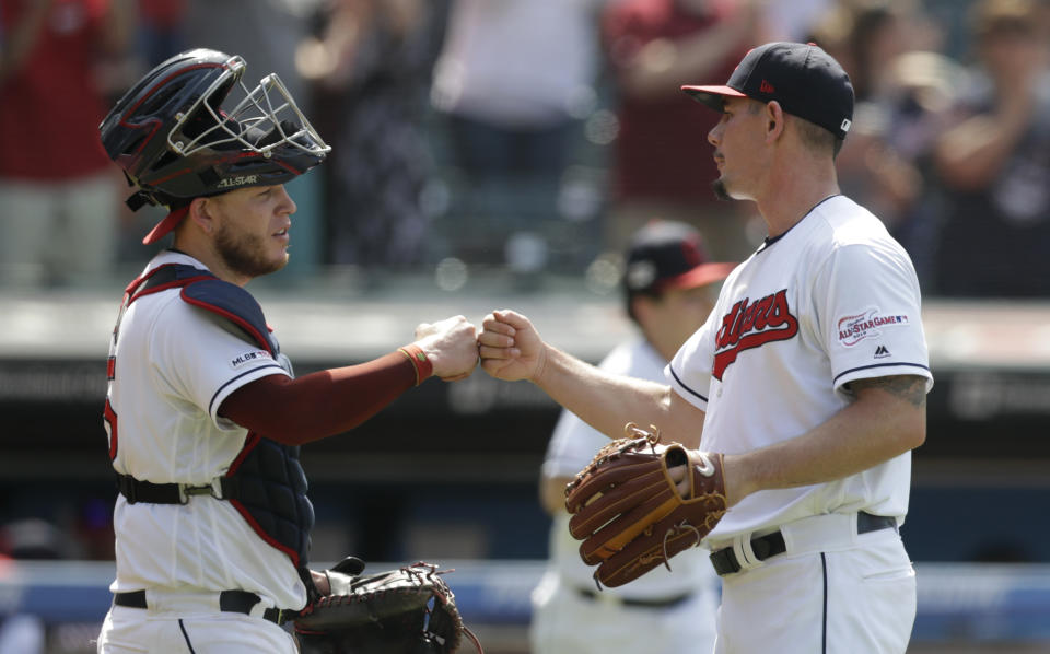 Cleveland Indians relief pitcher Nick Wittgren, right, is congratulated by catcher Roberto Perez after the Indians defeated the Kansas City Royals 5-3 in a baseball game, Wednesday, June 26, 2019, in Cleveland. (AP Photo/Tony Dejak)