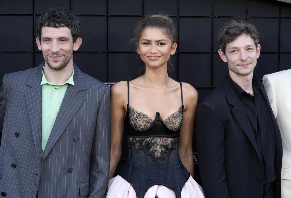 From left, Josh O'Connor, Zendaya and Mike Faist, cast members in "Challengers," pose together at the premiere of the film at the Regency Village Theatre, Tuesday, April 16, 2024, in Los Angeles. (AP Photo/Chris Pizzello)