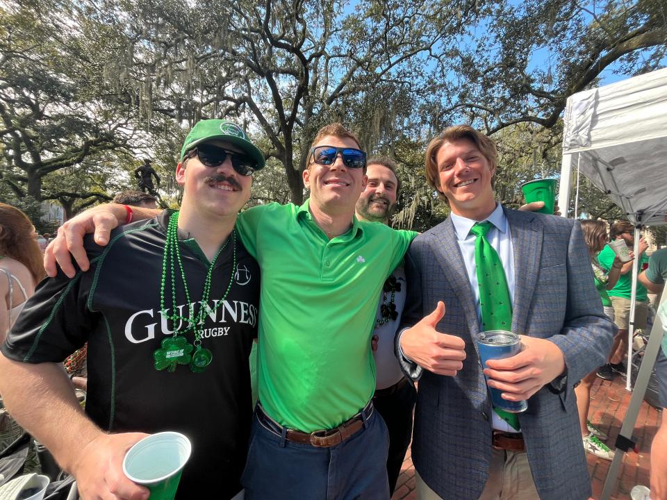 Austin Amick, in green shirt, of Savannah hit the jackpot when he nabbed spaces in Chippewa Square for three tents. “We were here at 5:45 then stormed the beaches” at 6 a.m. when parade-goers were allowed to move into the square.