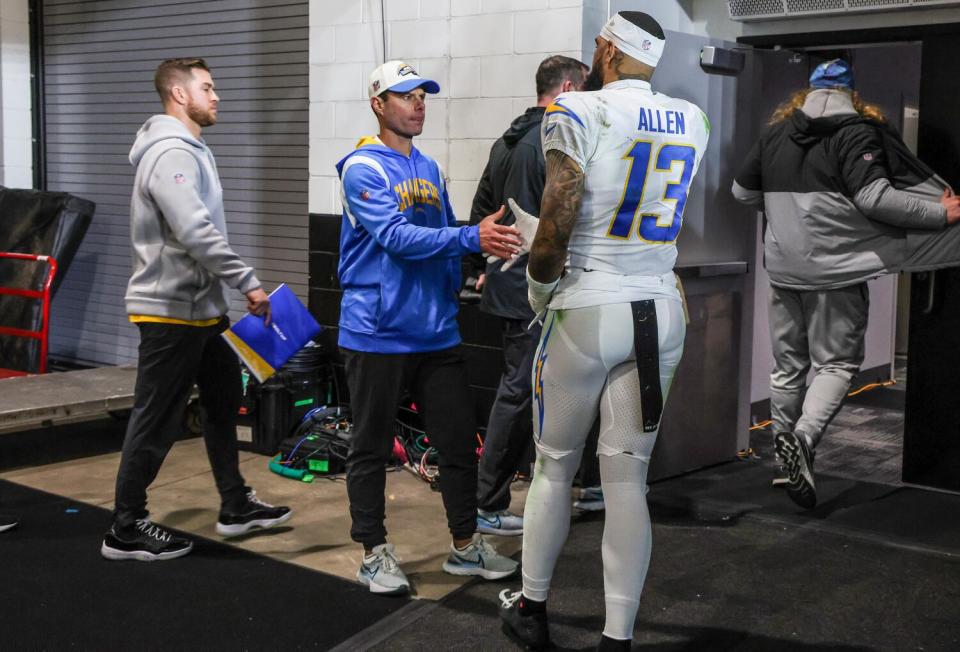 Chargers head Brandon Staley shakes hands with Keenan Allen (13) after losing to the Jaguars in an AFC playoff game.